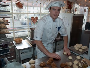 Pastry chef makes dough for Christmas cookie ornaments.