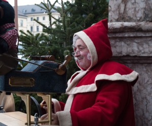Father Christmas with a music cart.