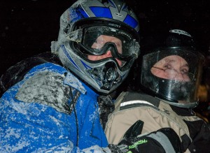 Snowmobiling on a stormy night in Lapland.